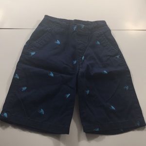 Dark blue short with light blue shark fins